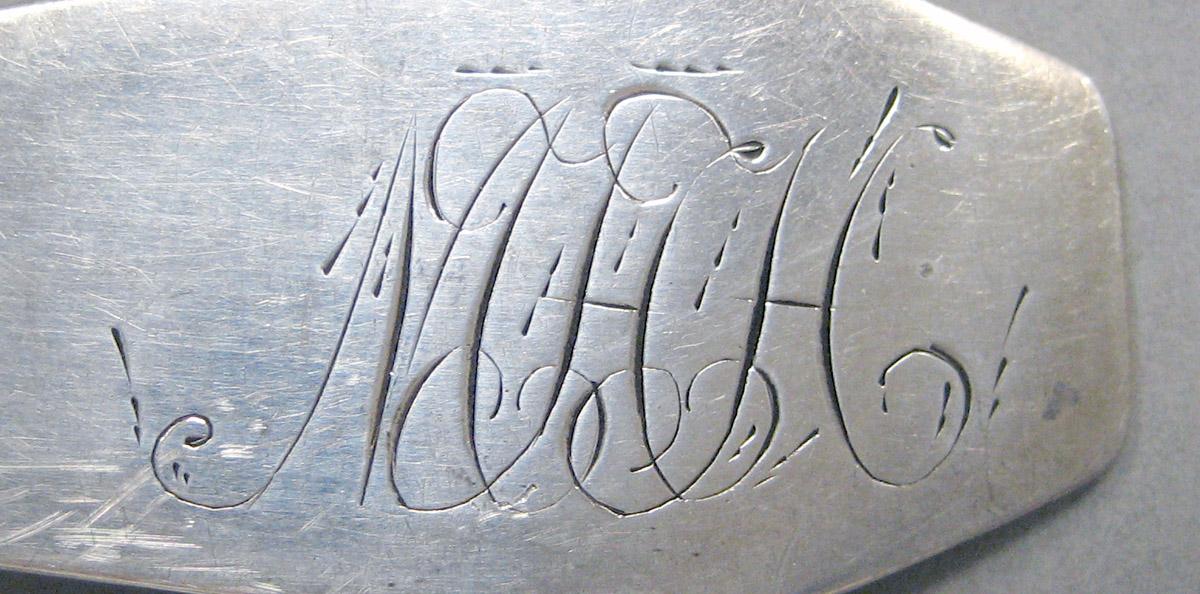 1998.0004.3639 Silver spoon engraving
