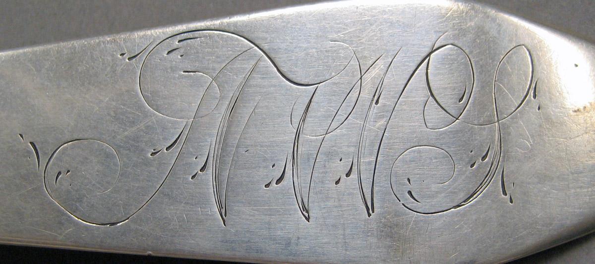 1998.0004.3640.001 Silver spoon engraving