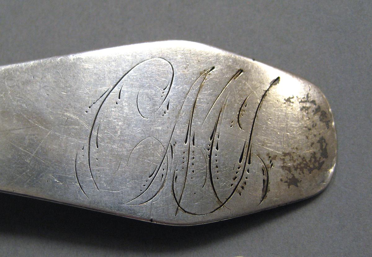 1998.0004.3810 Silver spoon engraving