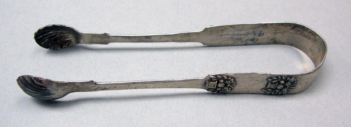 1998.0004.3834 Silver tongs view 1