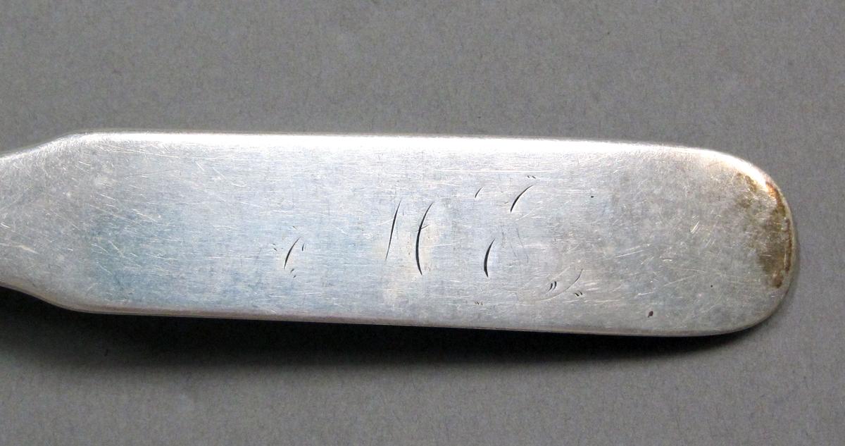 1998.0004.3922 Silver spoon engraving