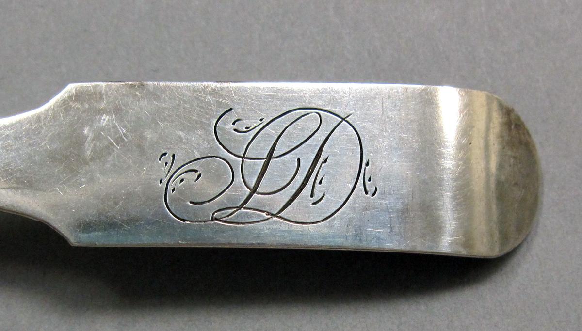 1998.0004.3937 Silver spoon engraving