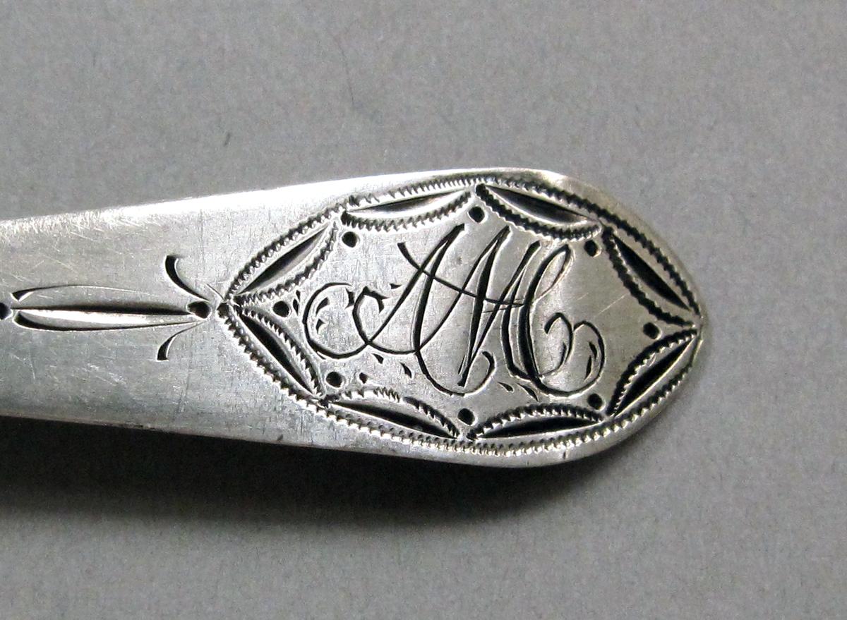 1998.0004.3940 Silver spoon engraving
