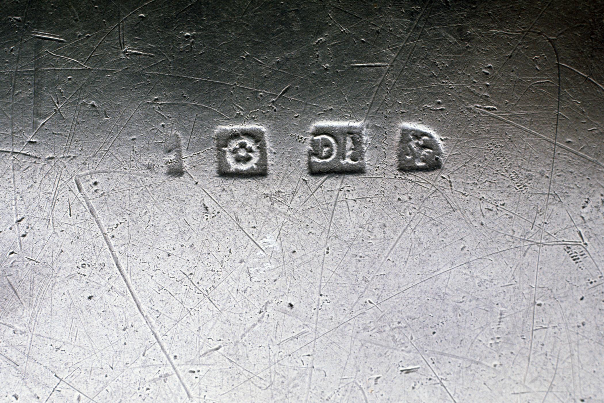 1958.0642 Pewter dish (marks)