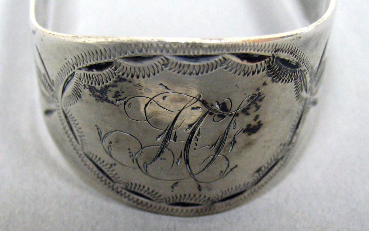 2006.0006.011 Silver Tongs engraving
