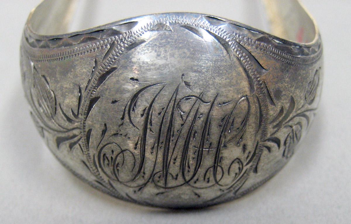 2006.0006.014 Silver Tongs engraving