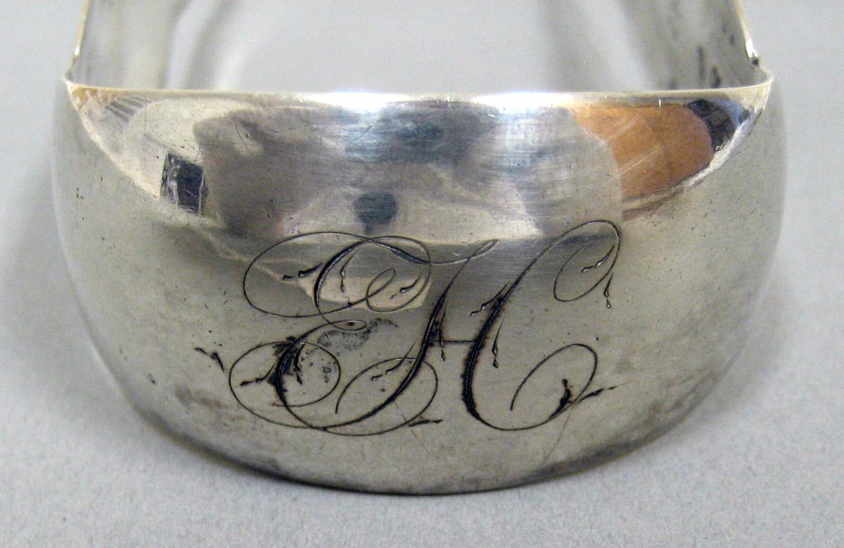 2006.0006.019 Silver Tongs engraving