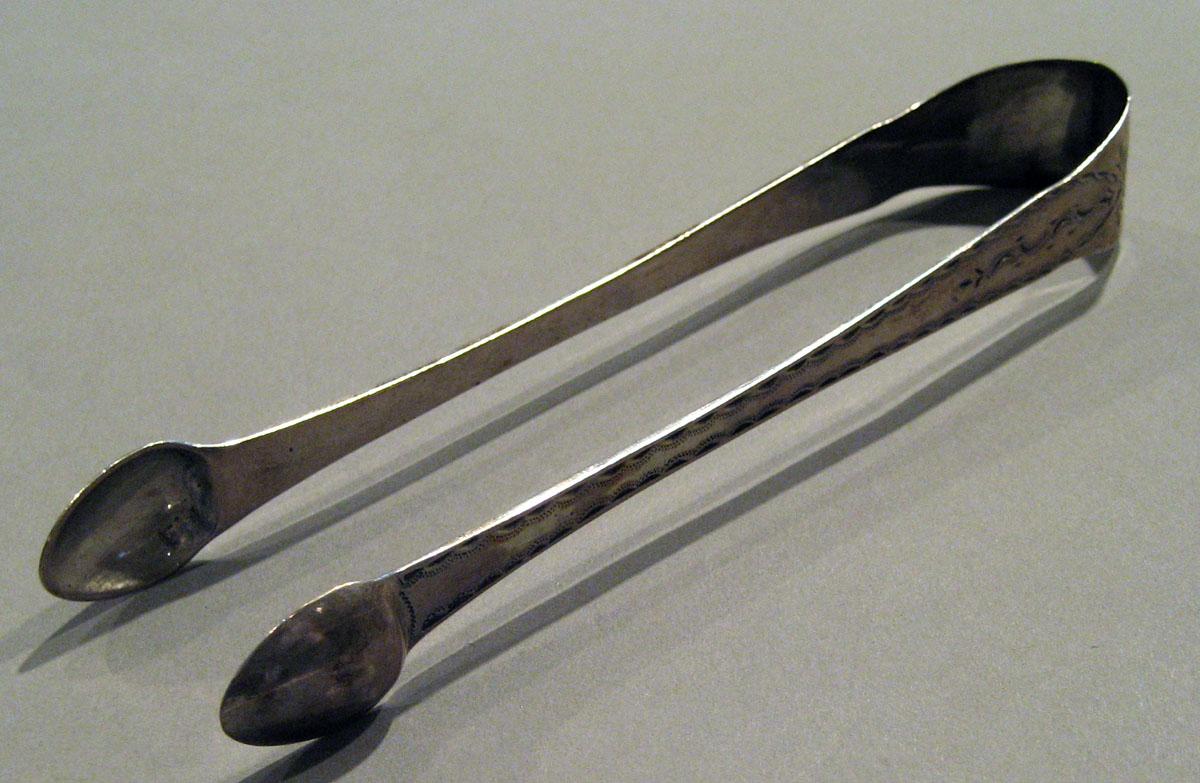 1998.0004.718 Silver Tongs view 1