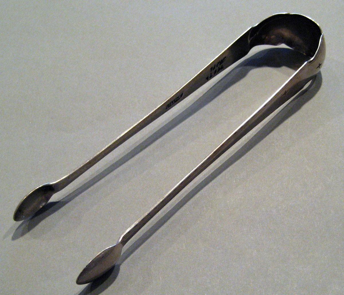 1998.0004.796 Silver Tongs view 1
