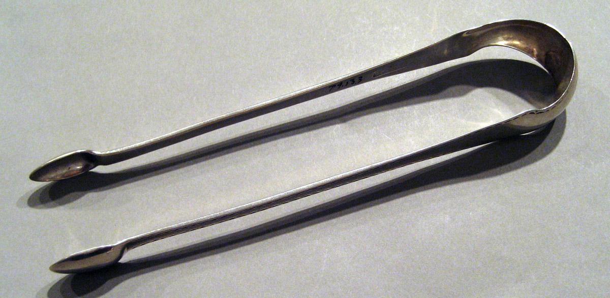 1998.0004.852 Silver Tongs view 1