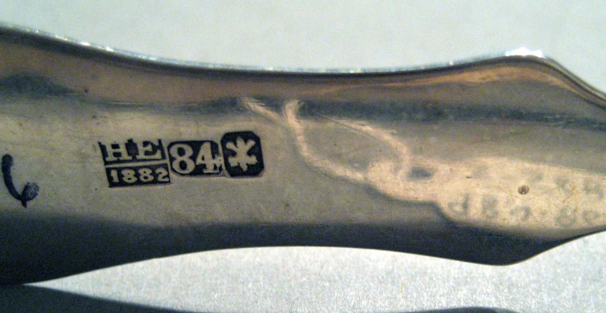 1998.0004.865 Silver Tongs mark 2