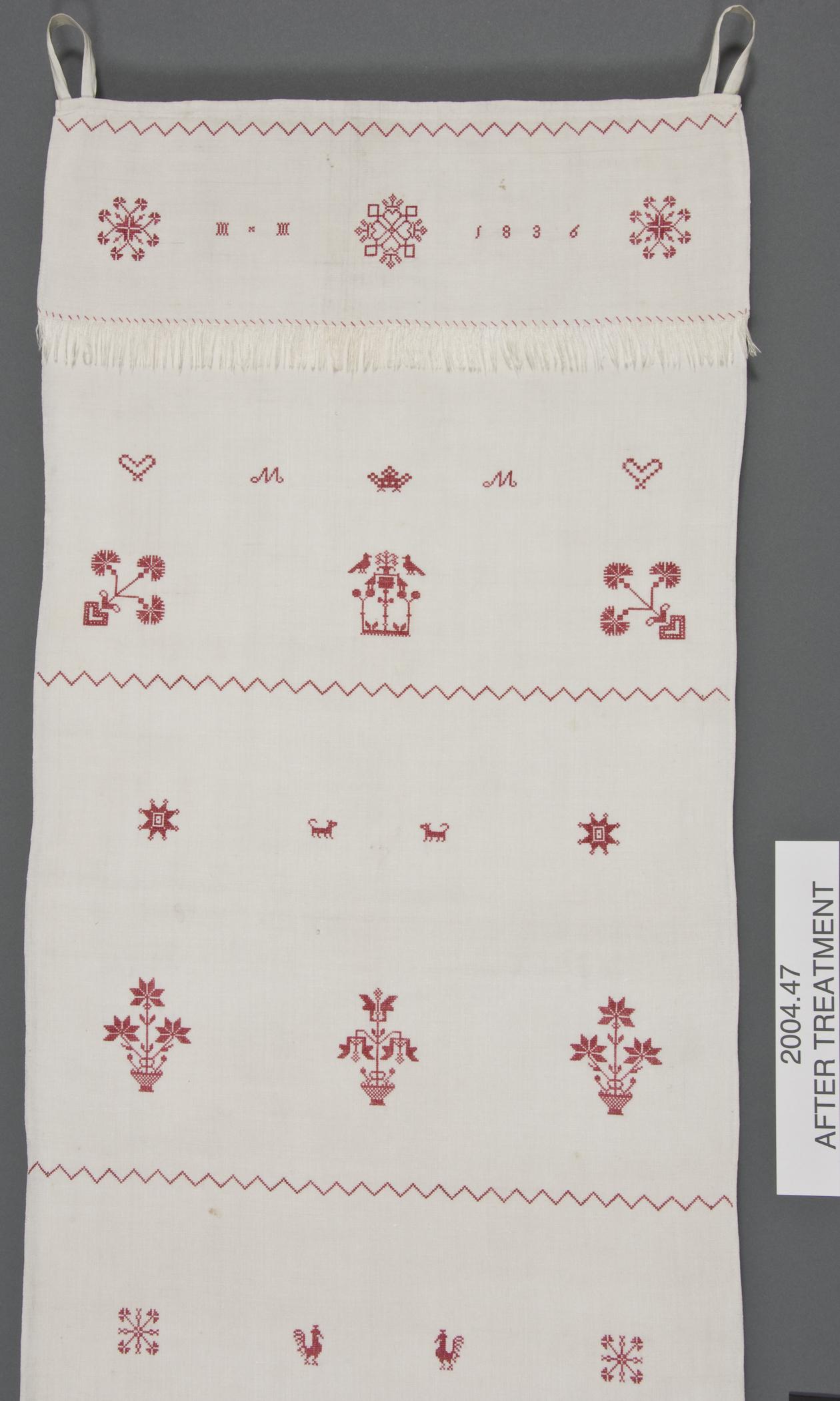 2000.0047 Towel, detail 2, after conservation treatment
