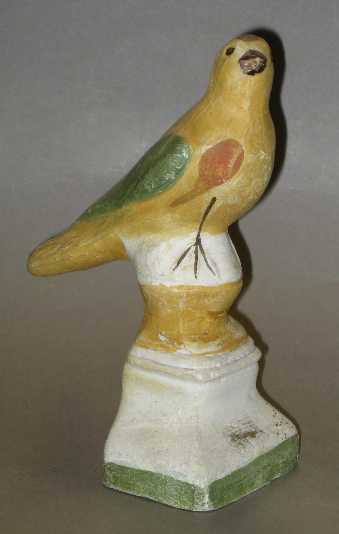2000.0057.044 Chalkware bird on ball