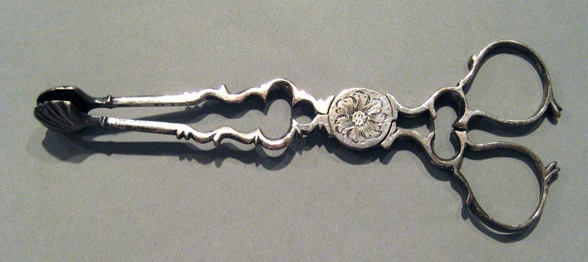 2001.0002.026 Silver Tongs upper surface