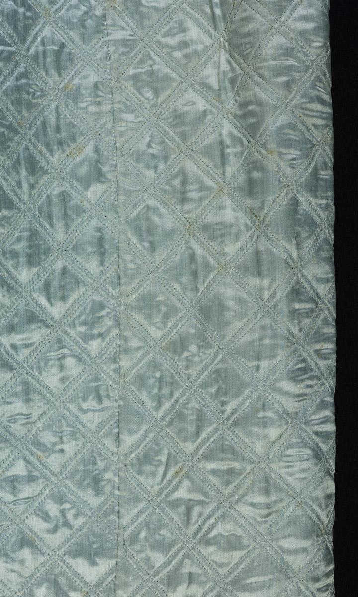 2001.0037.001 Petticoat, detail 1, before conservation treatment