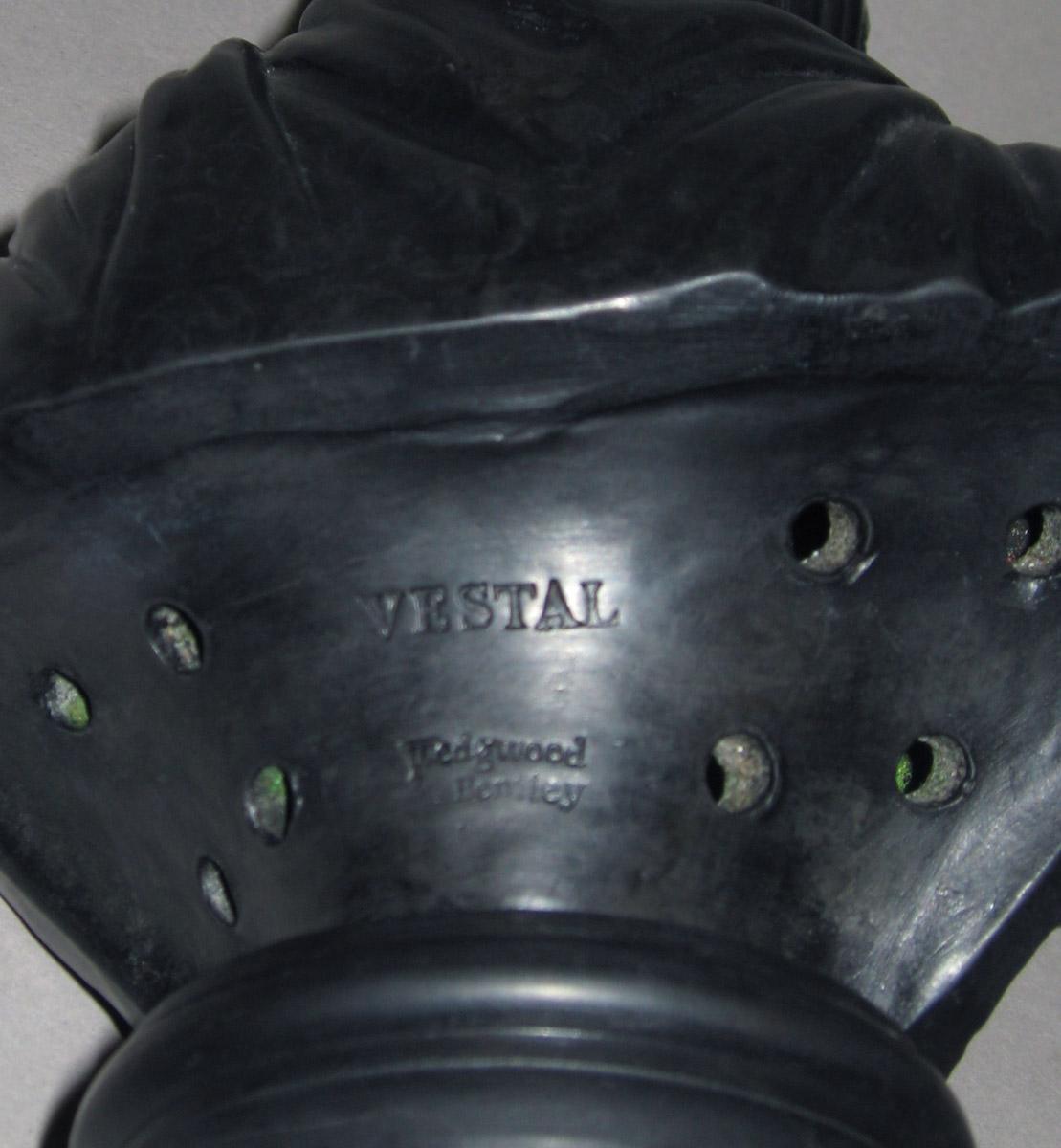 2001.0039.005 Black basalt bust (reverse)