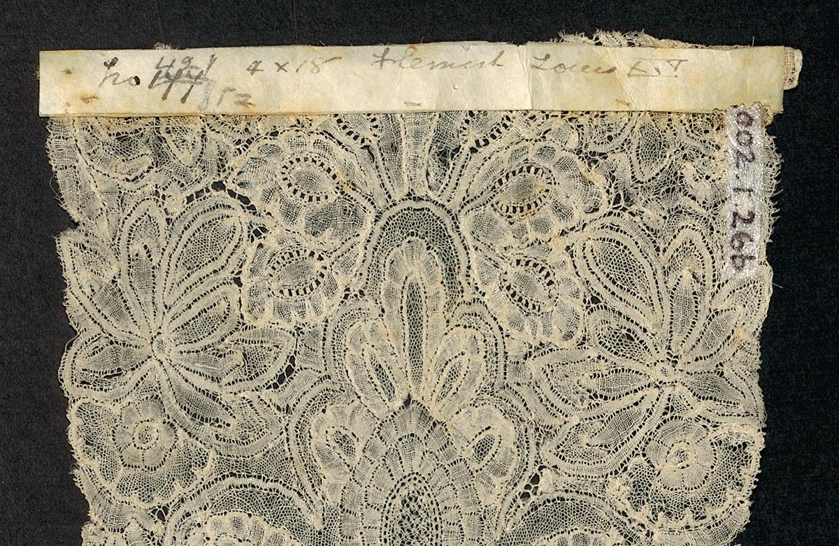 2002.0001.001.026 B Lappet, detail 1, reverse
