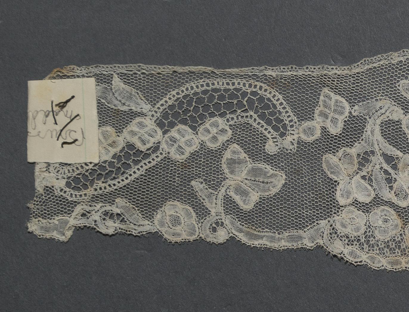2002.0001.001.041 Passementerie, detail 1, reverse