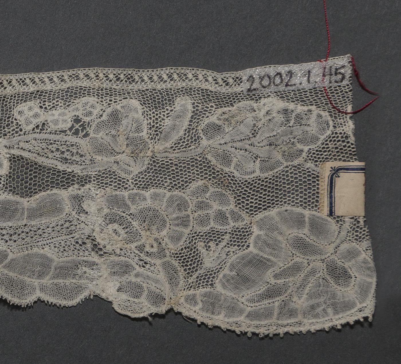 2002.0001.001.045 Passamenterie, detail 1, reverse