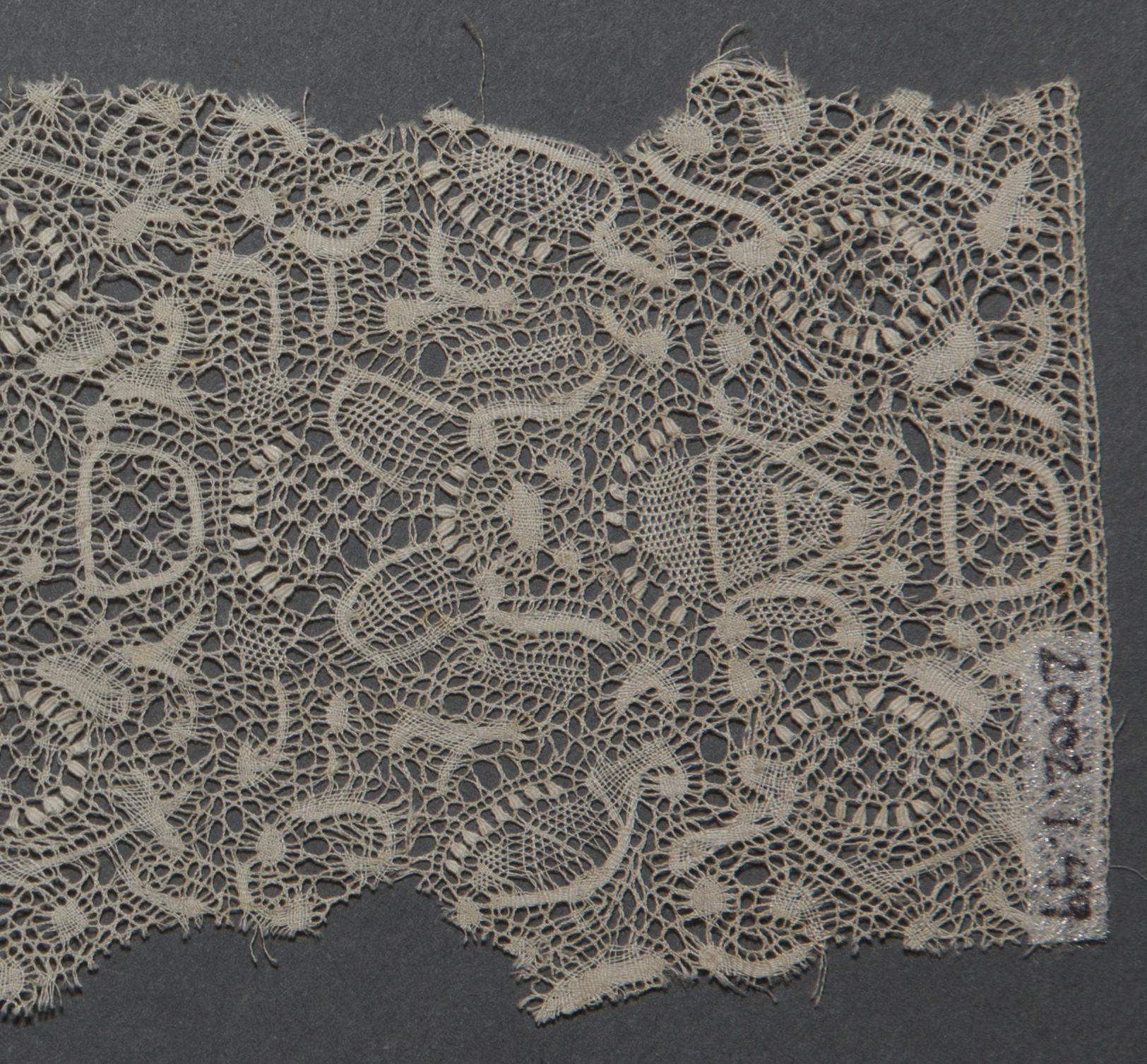 2002.0001.001.049 Textile fragment, detail 1, reverse