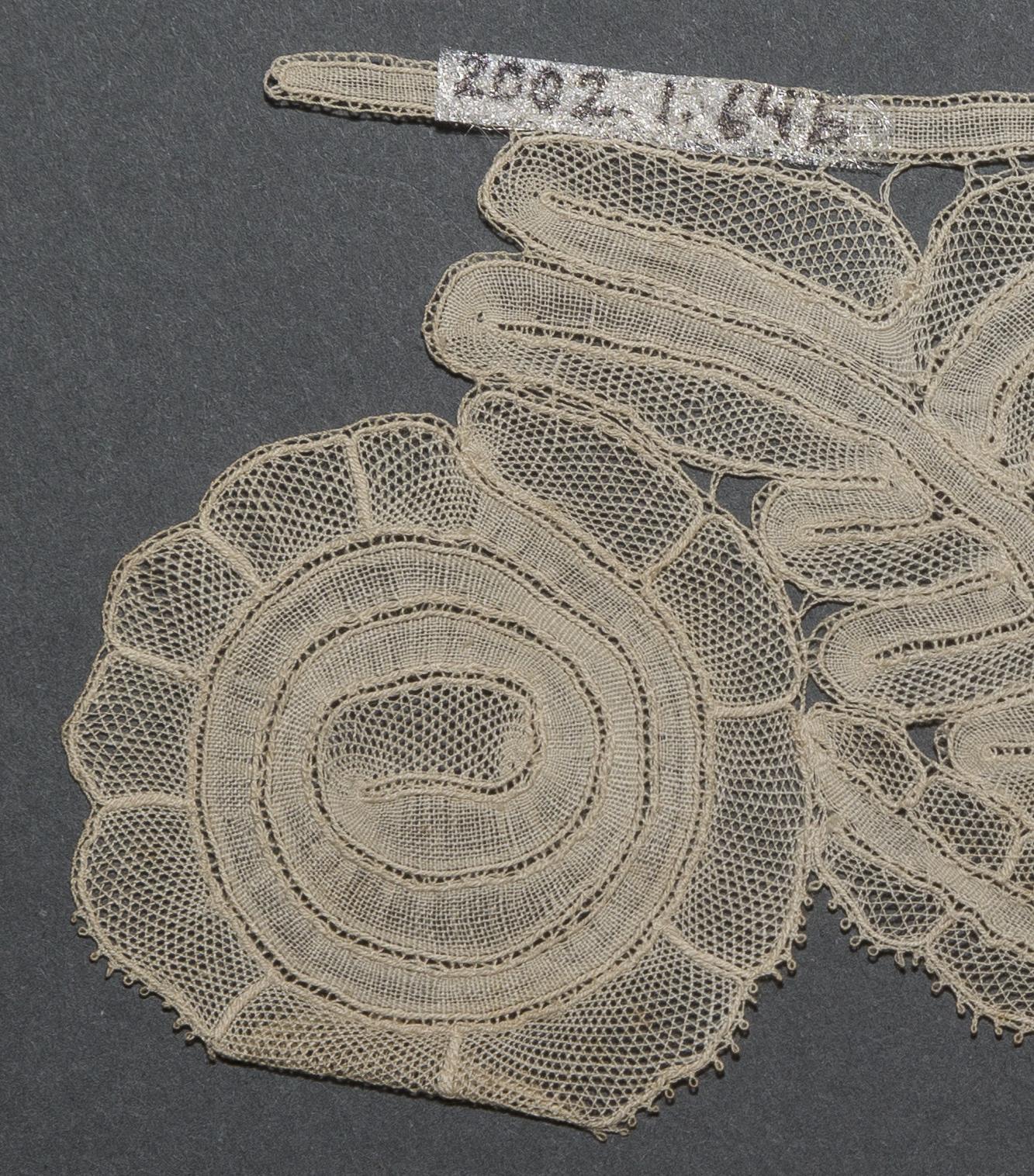 2002.0001.001.064 B Passementerie, detail 1, reverse