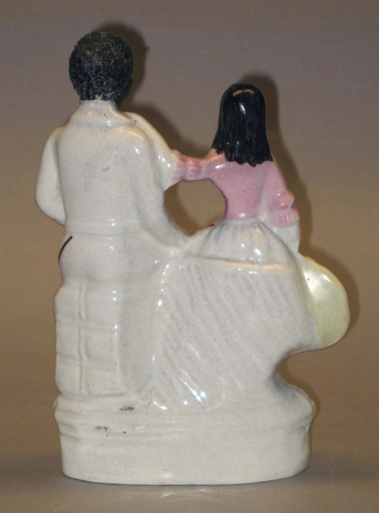 2002.0030.049 Eva and Uncle Tom figure group (back)