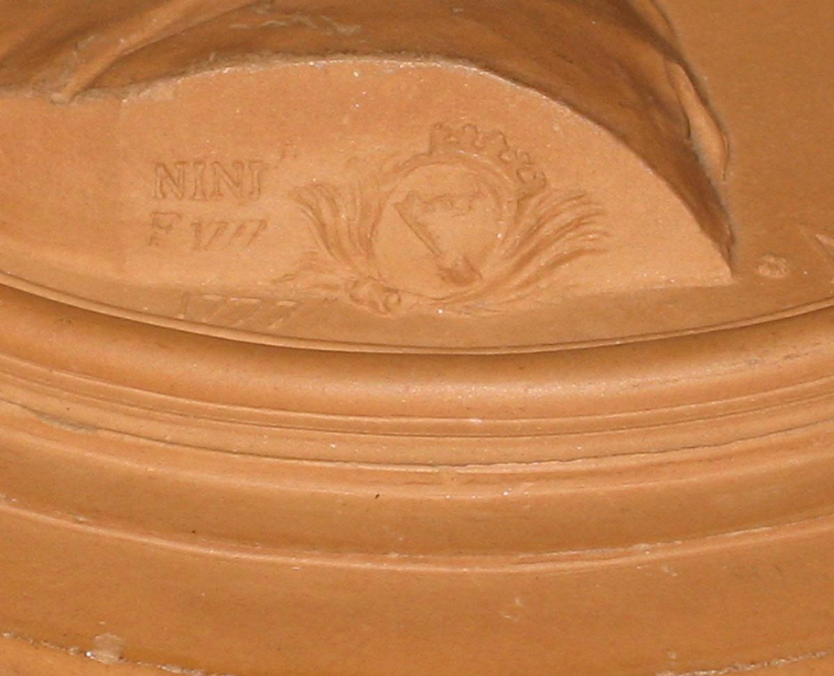 2003.0013.004 Redware portrait medallion (signature)