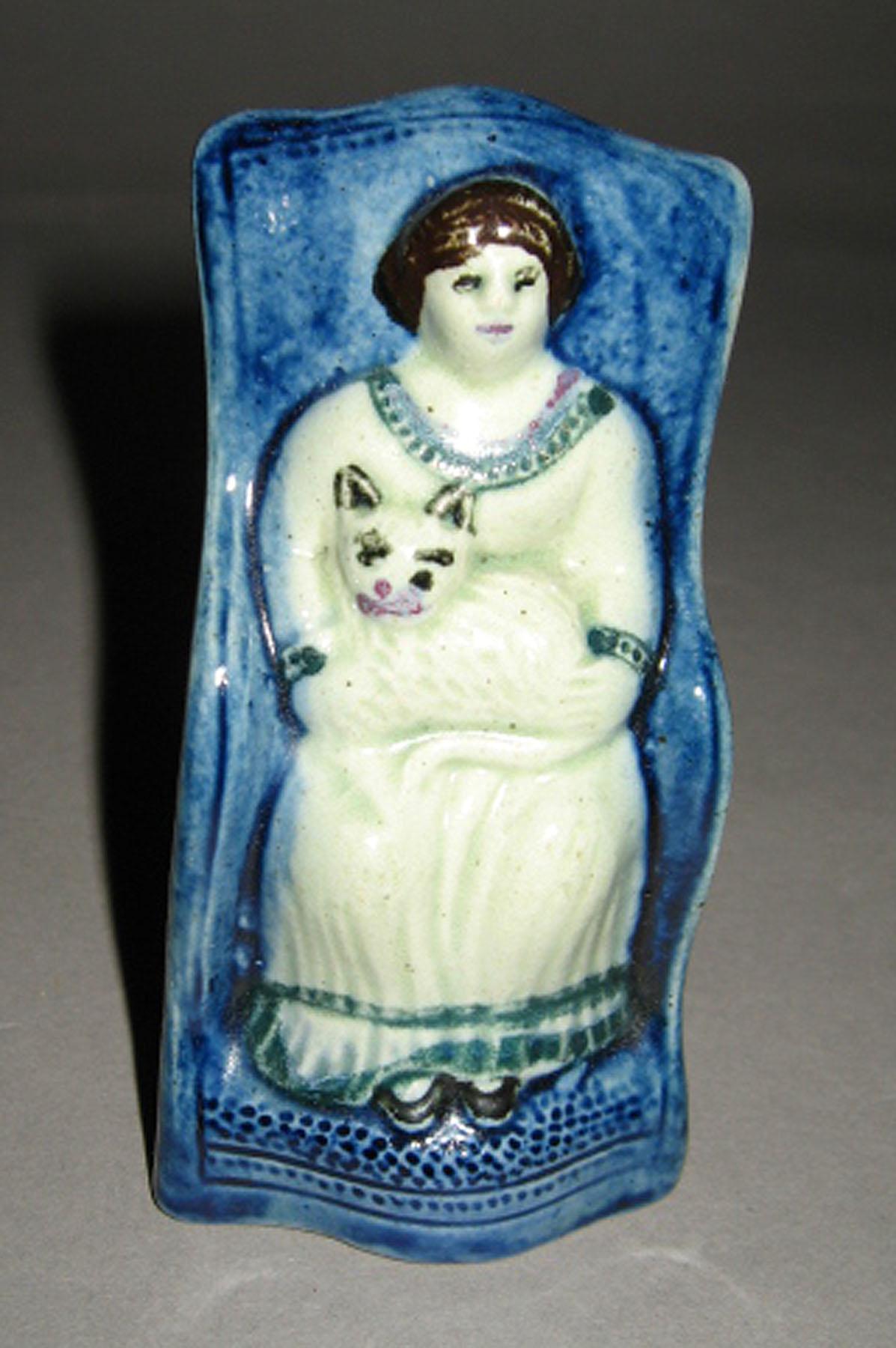 2003.0013.128 Figure (Girl and cat)