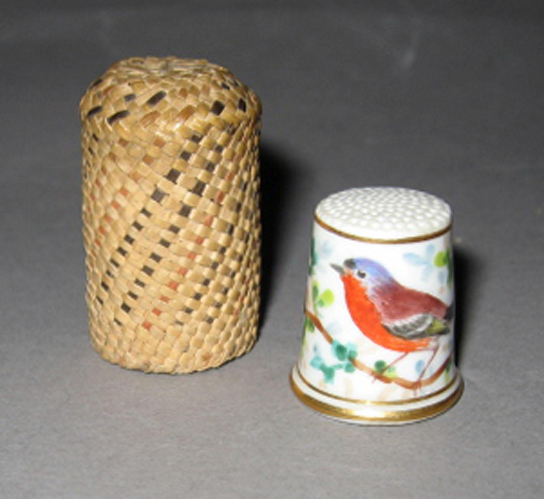 2003.0013.142 Porcelain thimble with straw case