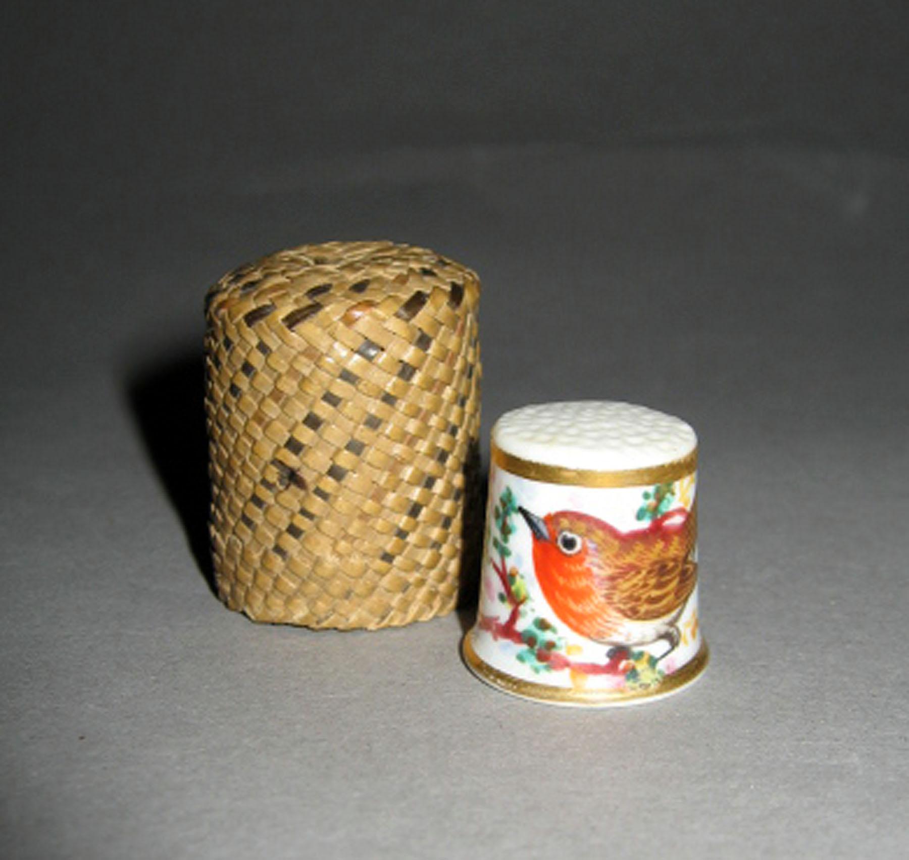 2003.0013.157.001 A, B Porcelain thimble with straw case