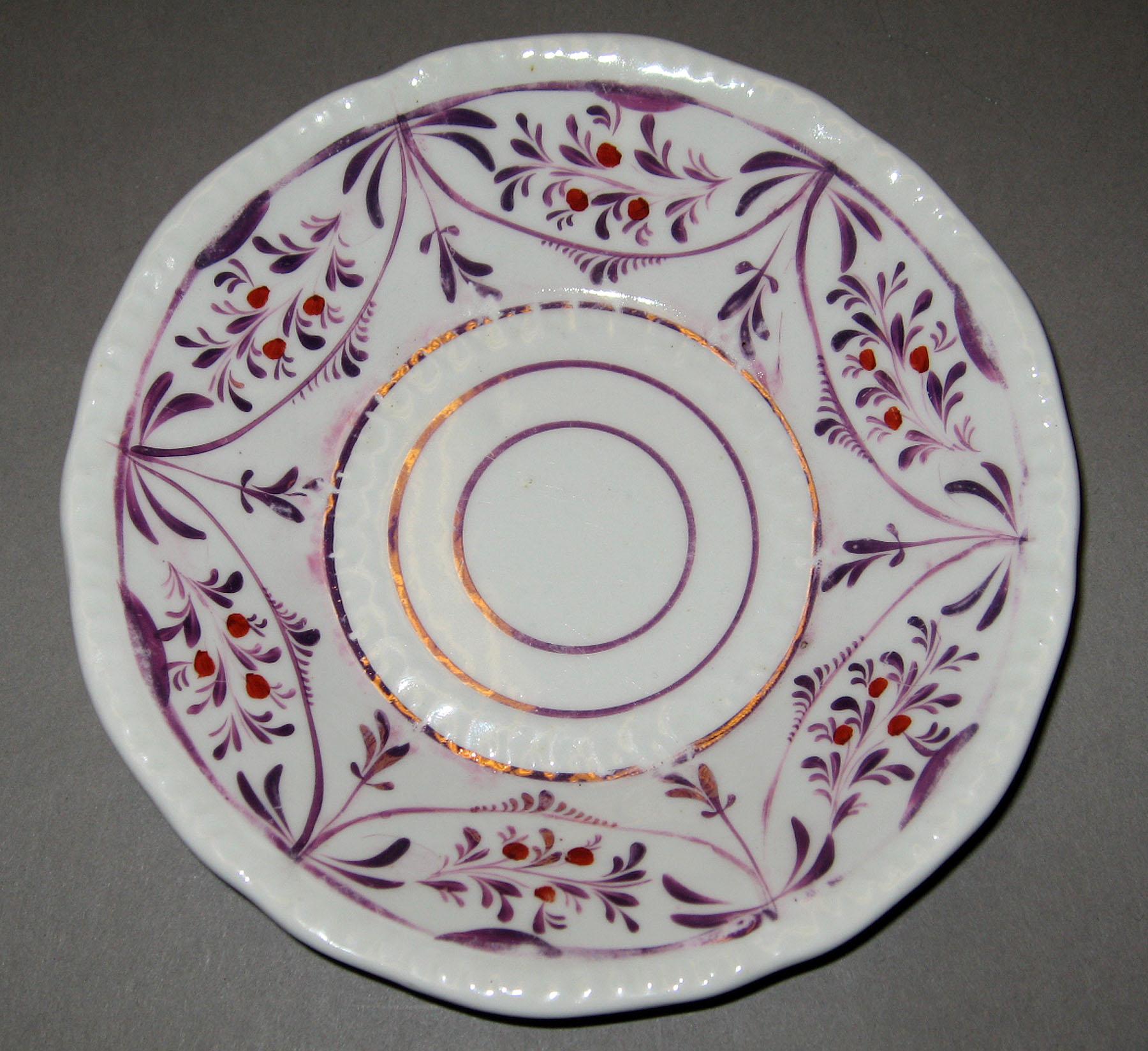 2004.0018.001.008 Lusterware Saucer