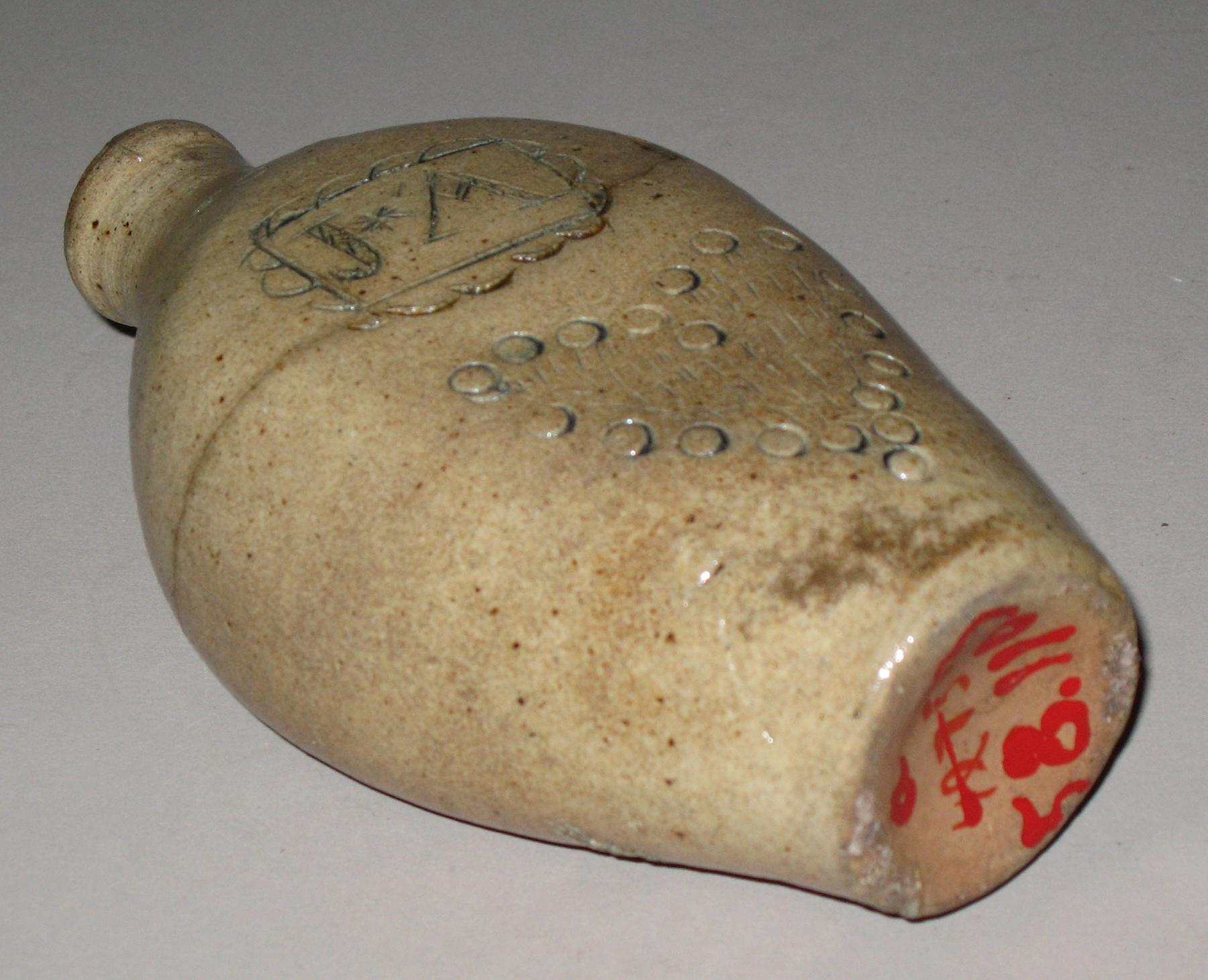 1958.1103 A, B Salt-glazed stoneware flask or pocket bottle (bottom)