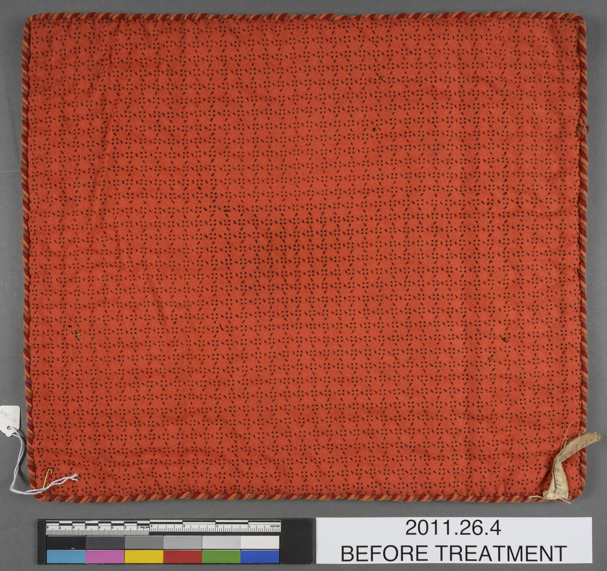 2011.0026.004 Cushion cover, view 2, reverse, before conservation treatment