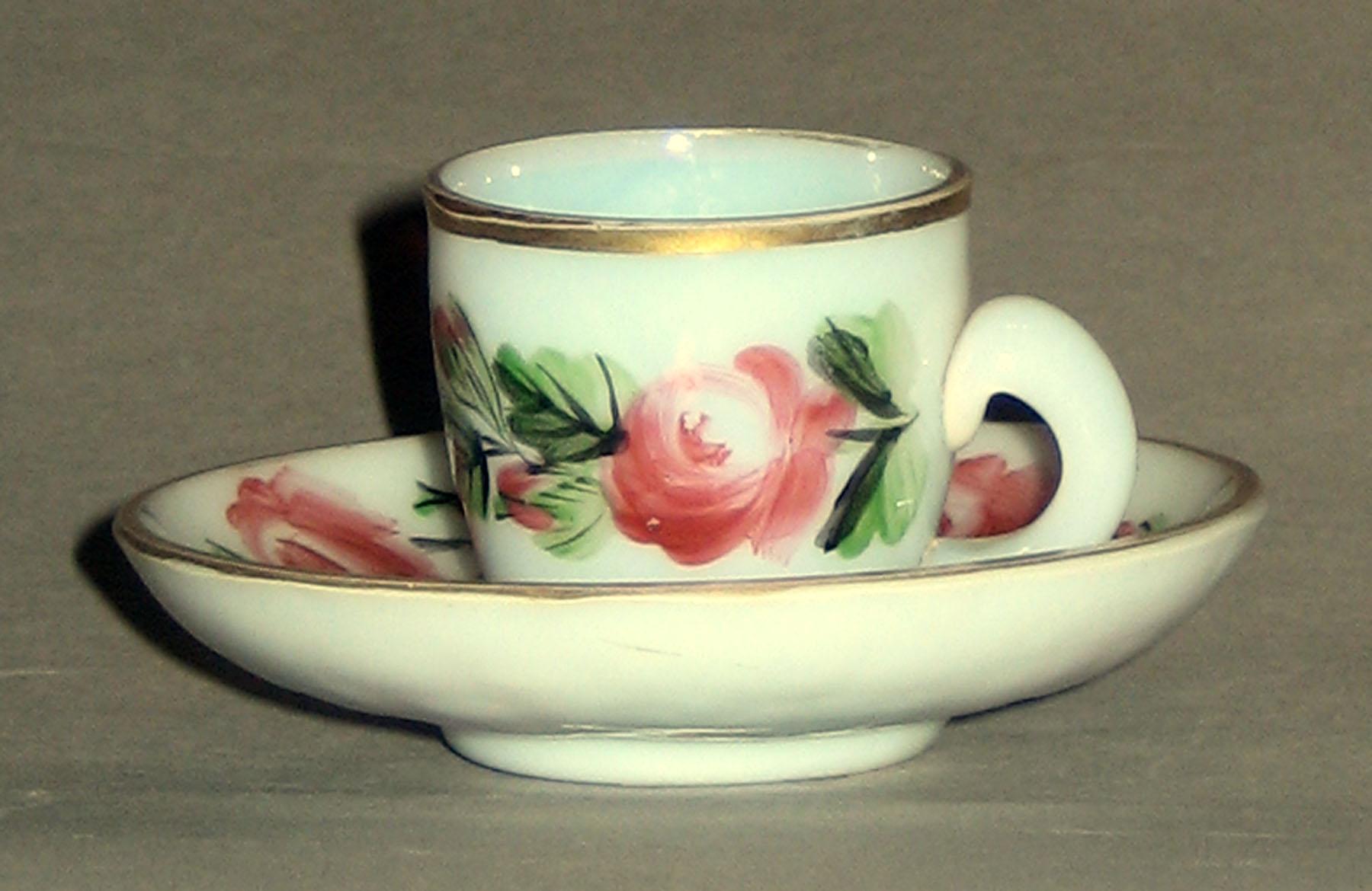1958.1429.002 A, B White Glass Cup and Saucer