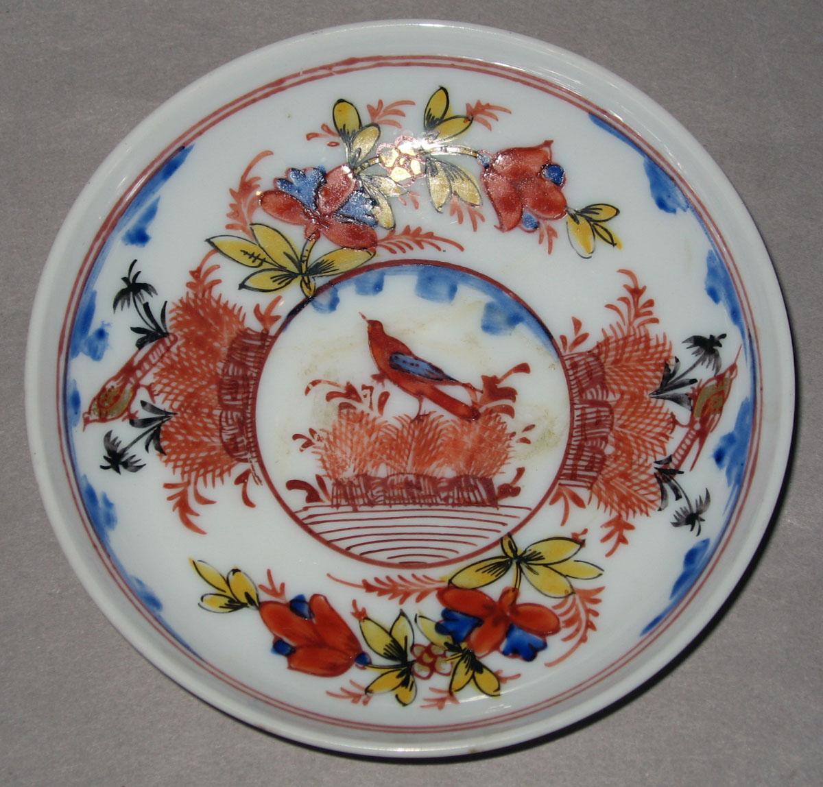 1958.1432 White glass saucer