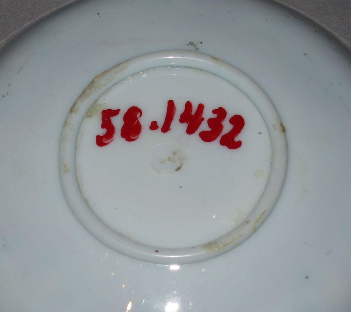 1958.1432 White glass saucer (underside)