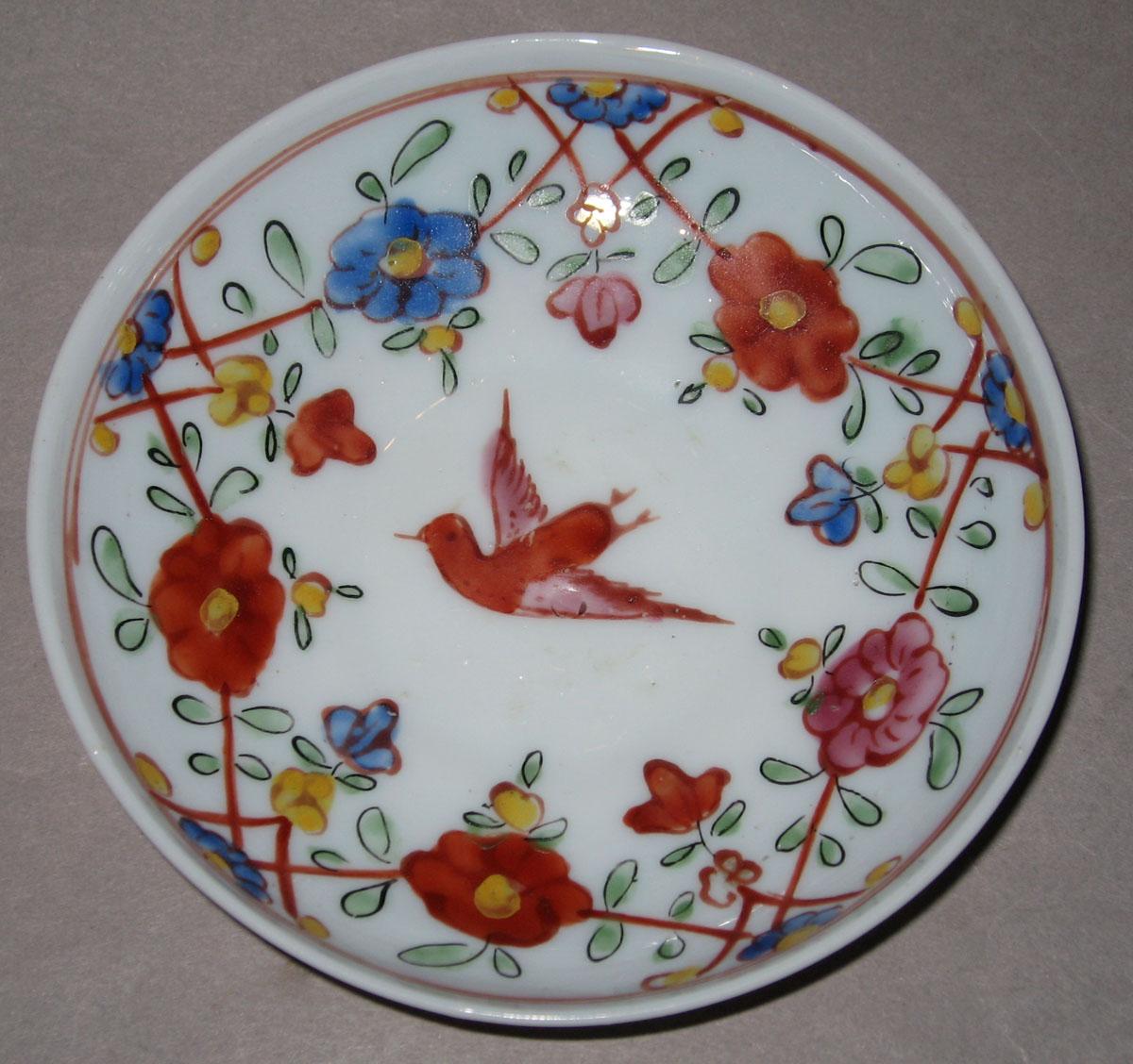 1958.1436 White glass saucer