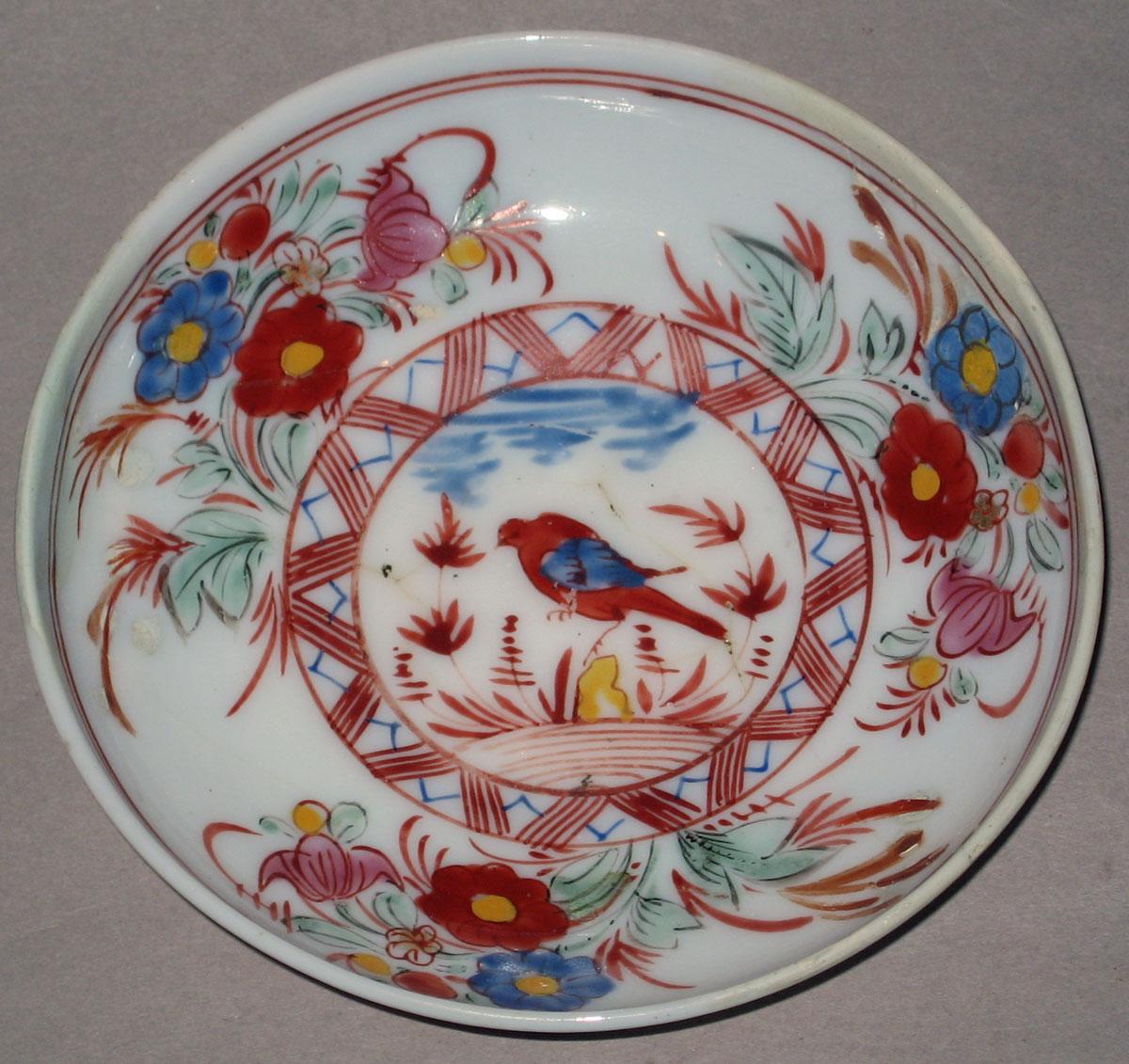 1958.1437 White glass saucer