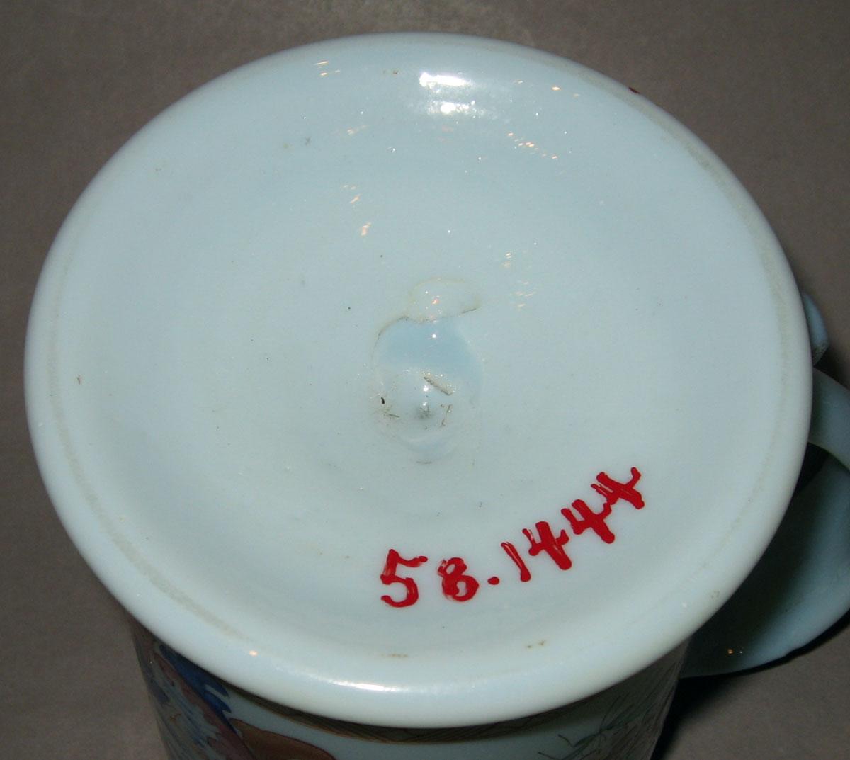 1958.1444 White glass mug (underside)