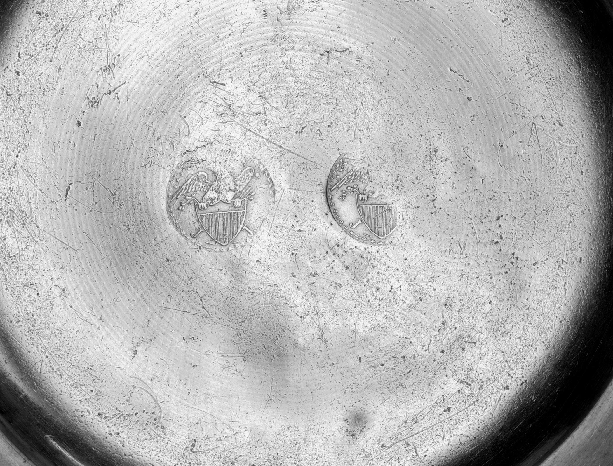 1953.0024 Pewter plate (marks)