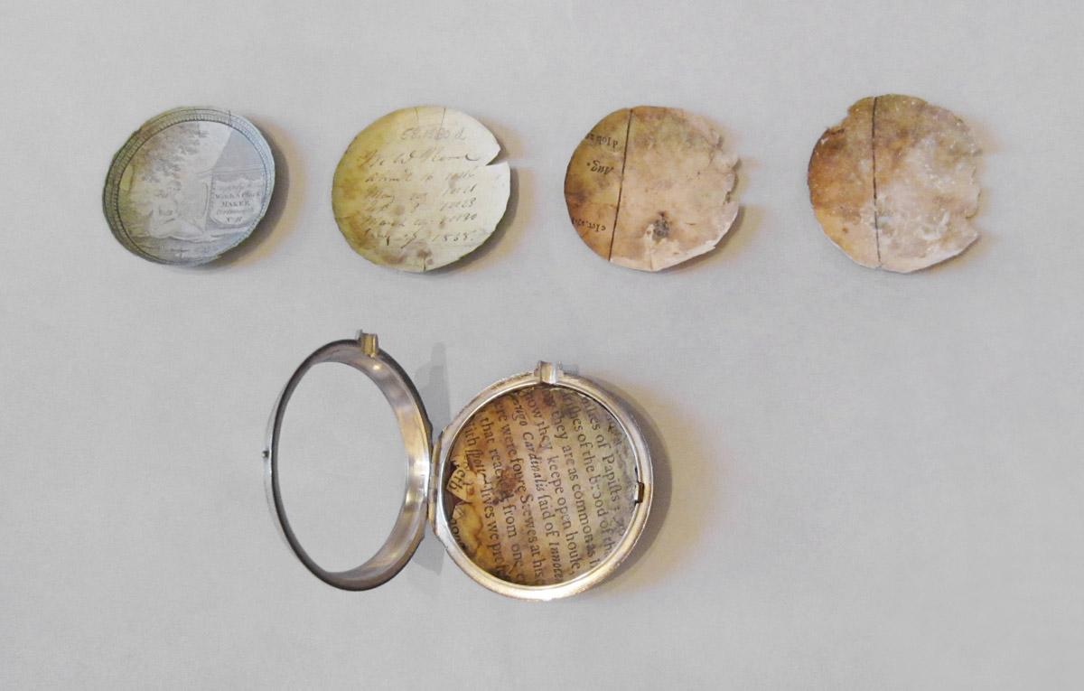 1958.1580 A Watch case, D Watch paper, E Watch paper