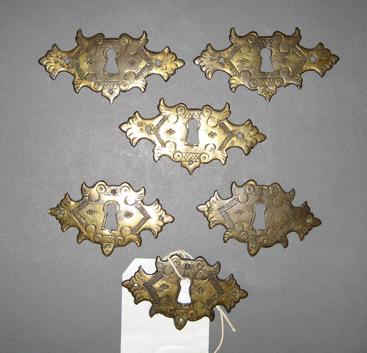 1953.0029.001-.006 Escutcheon