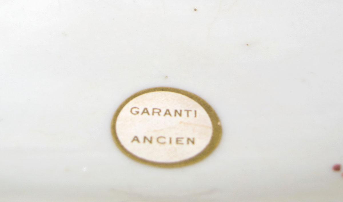 1958.2085 B Porcelain flower container label