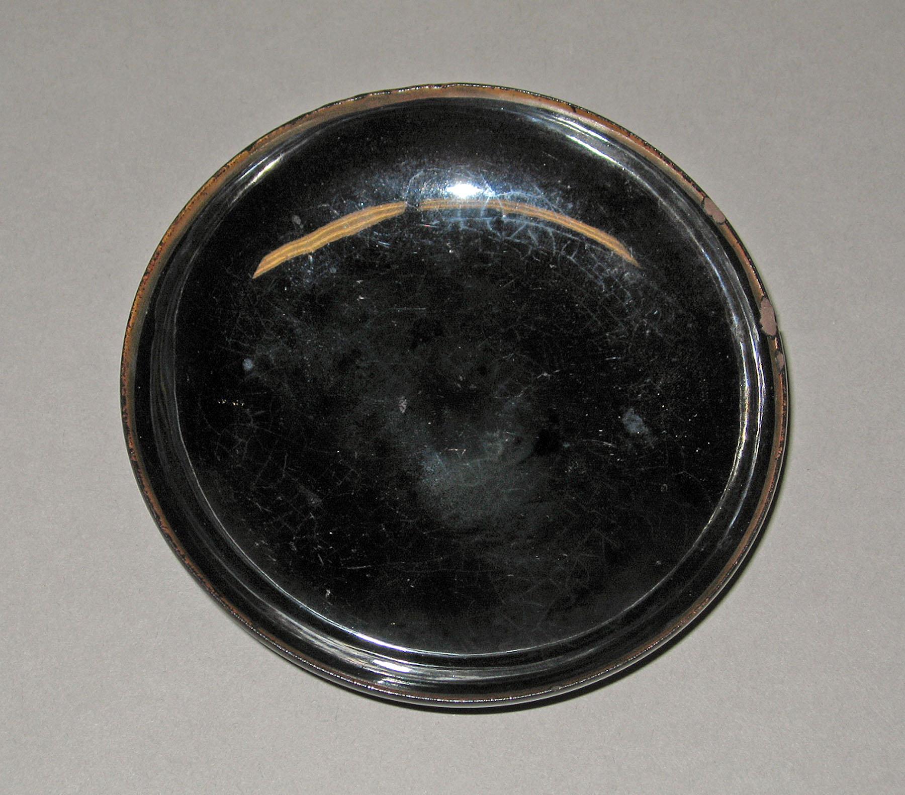 1958.2286 Blackware saucer