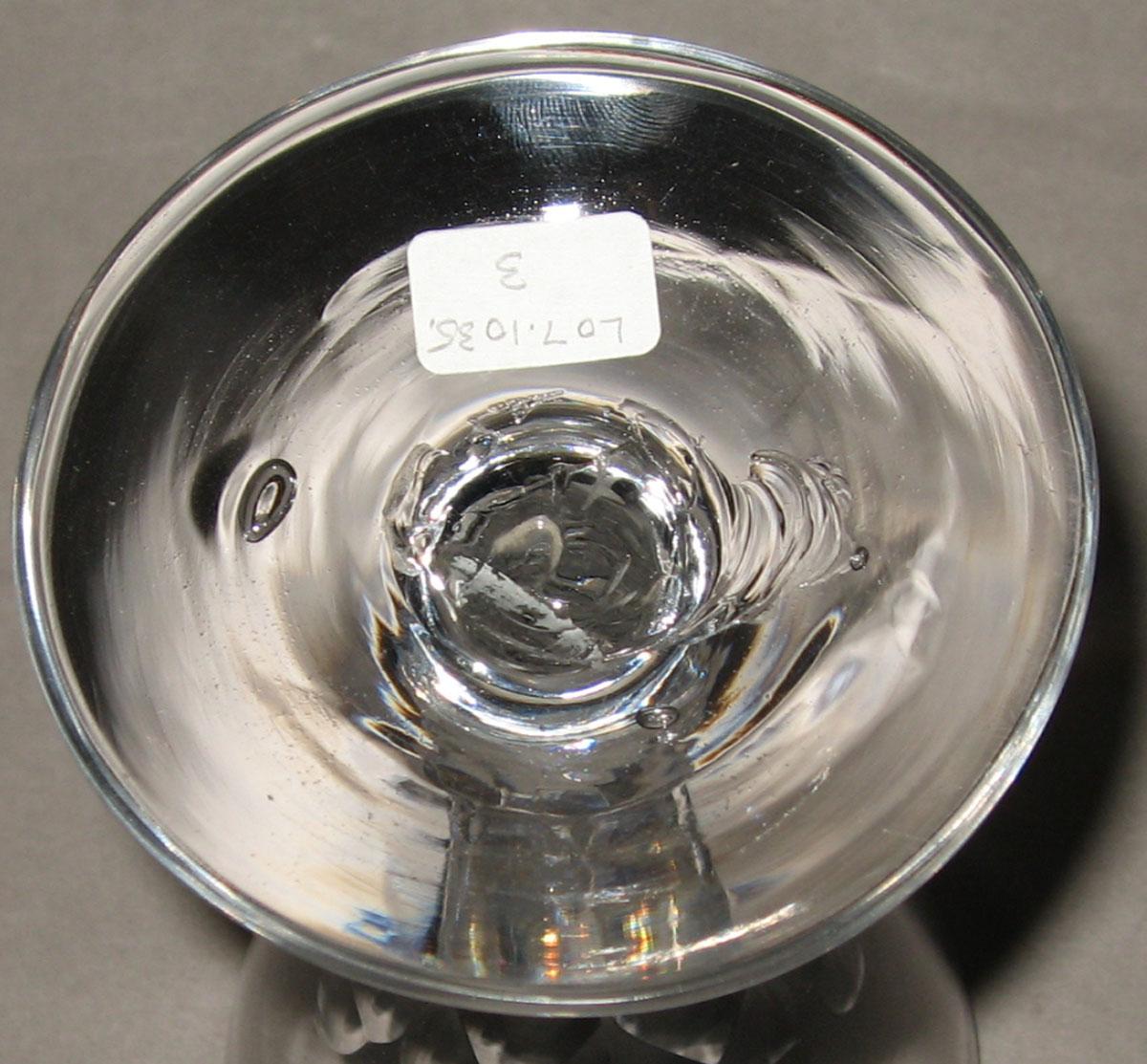 2007.0023.003 Colorless glass faceted stem wineglass (underside)