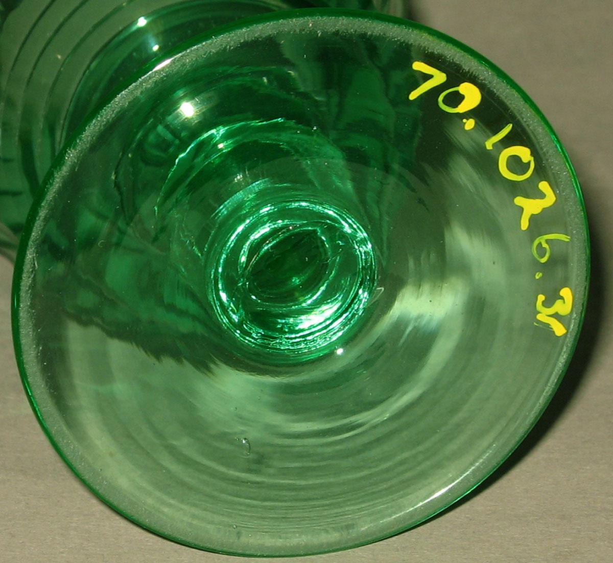 1970.1026.031 Green glass wineglass (underside)