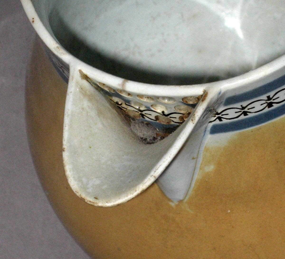 2007.0028.005 A, B Dipped ware covered jug (detail)