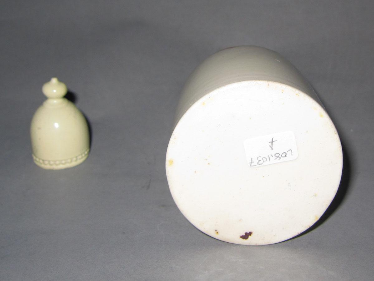 2008.0031 F,G Creamware bottle and lid underside