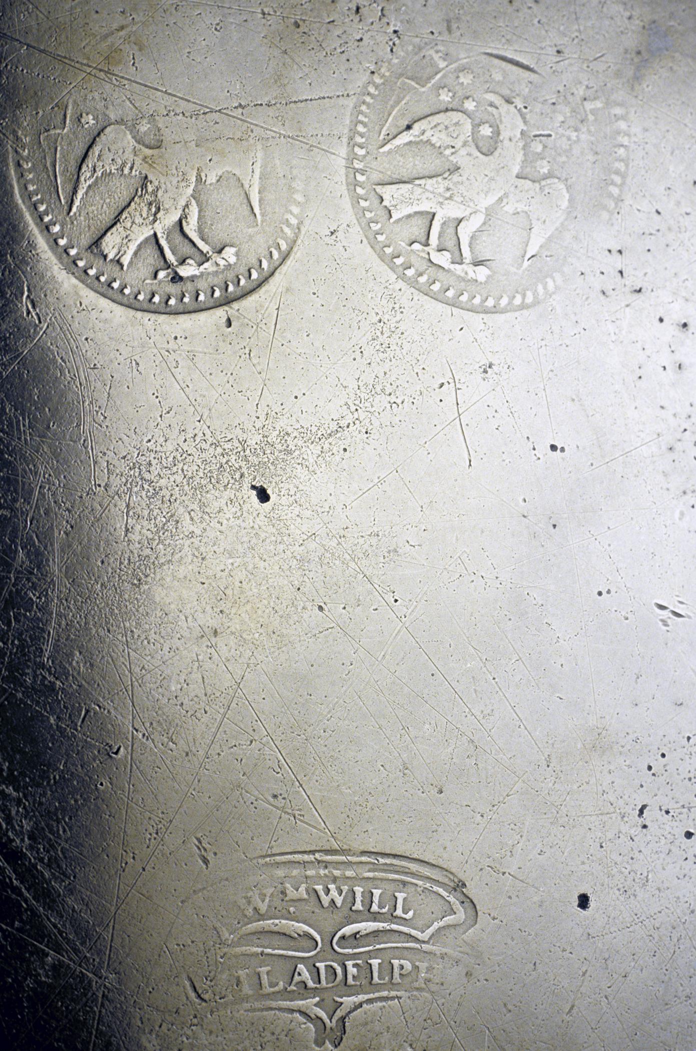 1953.0043 Pewter dish (marks)