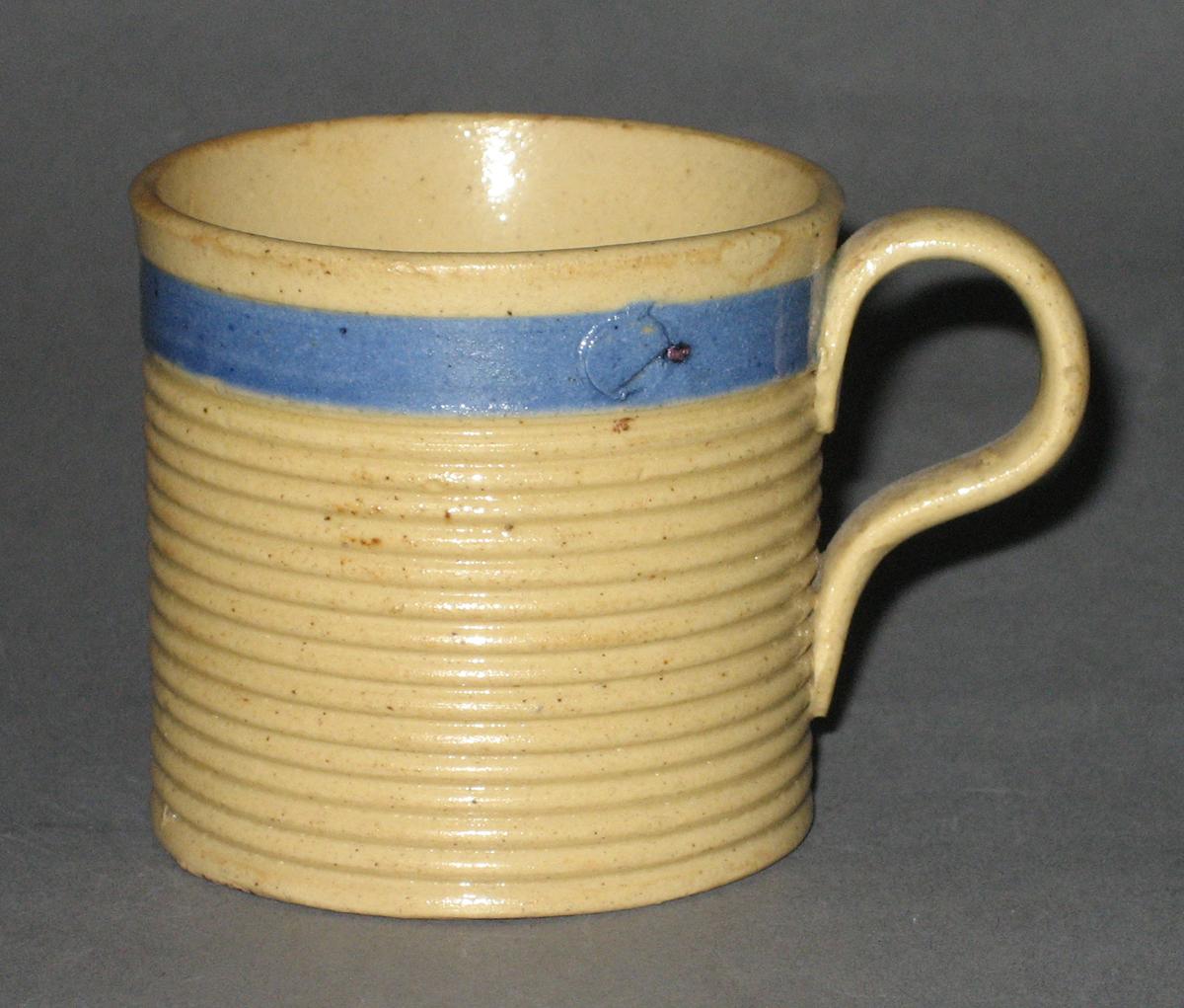 2008.0053.020 Yellow (dipped) ware mug